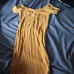 a yellow off the shoulder dress